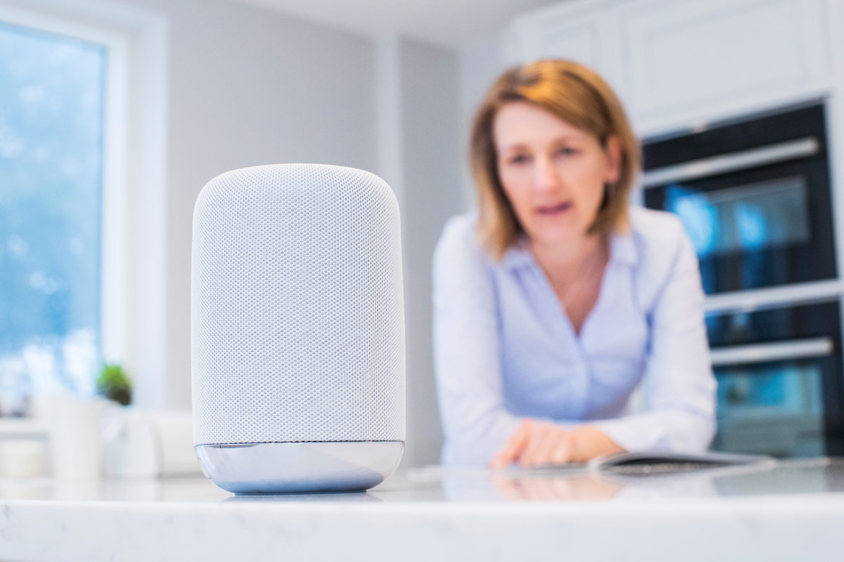 image of woman using an Amazon Alexa